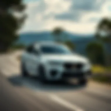 2022 BMW X5 xDrive40i M Sport on the Road 2022 BMW X5 xDrive40i M Sport in motion on a scenic road