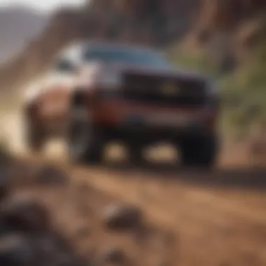 Durability of Chevy Trucks in Challenging Conditions Chevy truck on rugged terrain showcasing durability