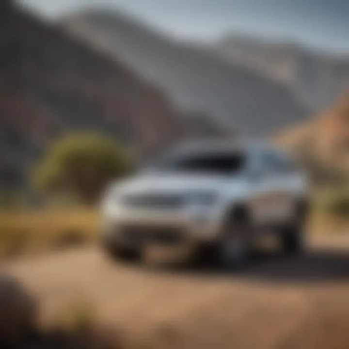 A sleek pre-owned Jeep Grand Cherokee parked in a scenic landscape