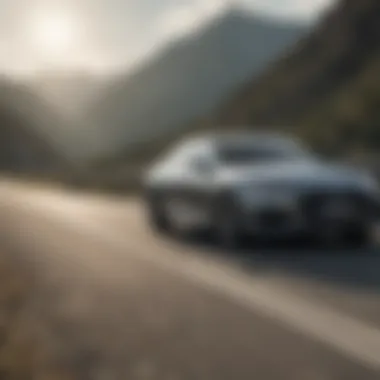 An Audi sedan in motion on a scenic road highlighting its performance