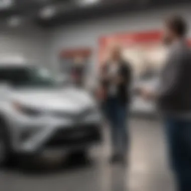 Customer Experience at Toyota Dealership A satisfied customer receiving keys to their new Toyota from a dealership representative.