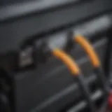 Detailed view of a positive cable connected to a car battery terminal